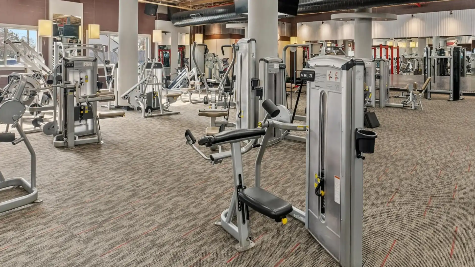 Resistance machines and cardio floor at Flex Fitness